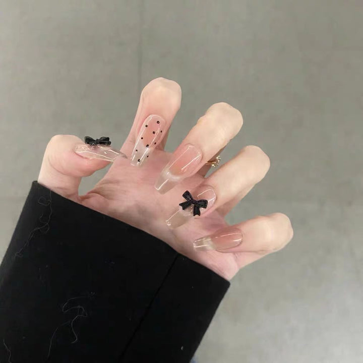 Artificial nails with playful bow design Bowlift