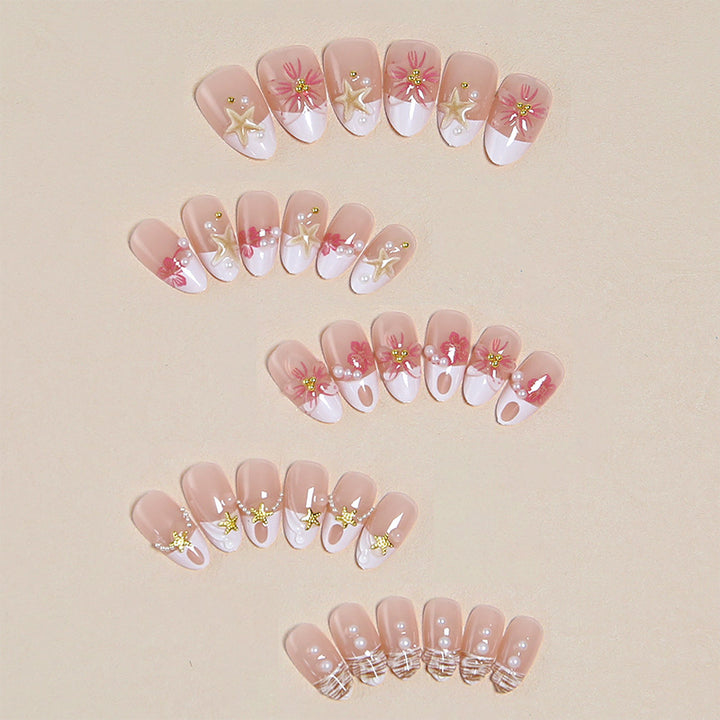 Elegant artificial nails with floral designs and glitter accents Bowlift