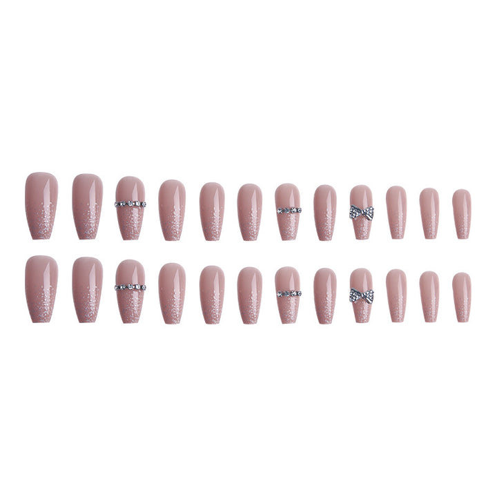 Glamorous artificial nails with sparkling rhinestone and glitter elements Bowlift