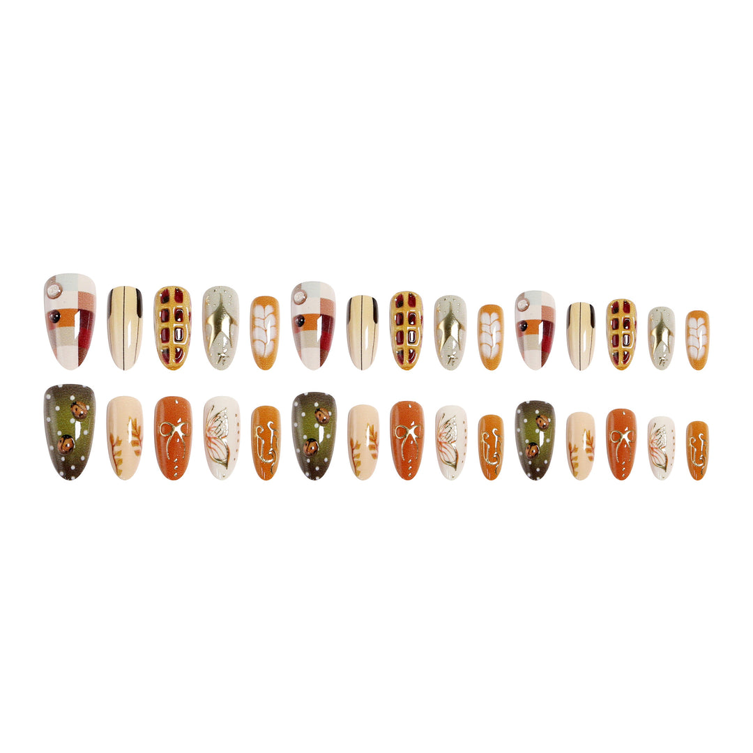 Artificial nail set with handcrafted botanical patterns and elegant accents Bowlift