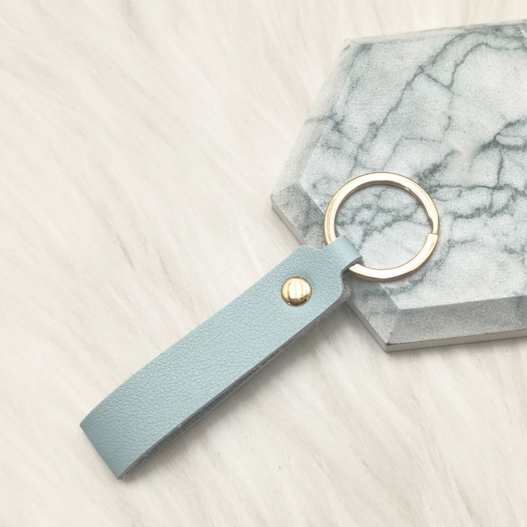 Unisex keychain made of high-quality synthetic leather with elegant metal embellishment Bowlift