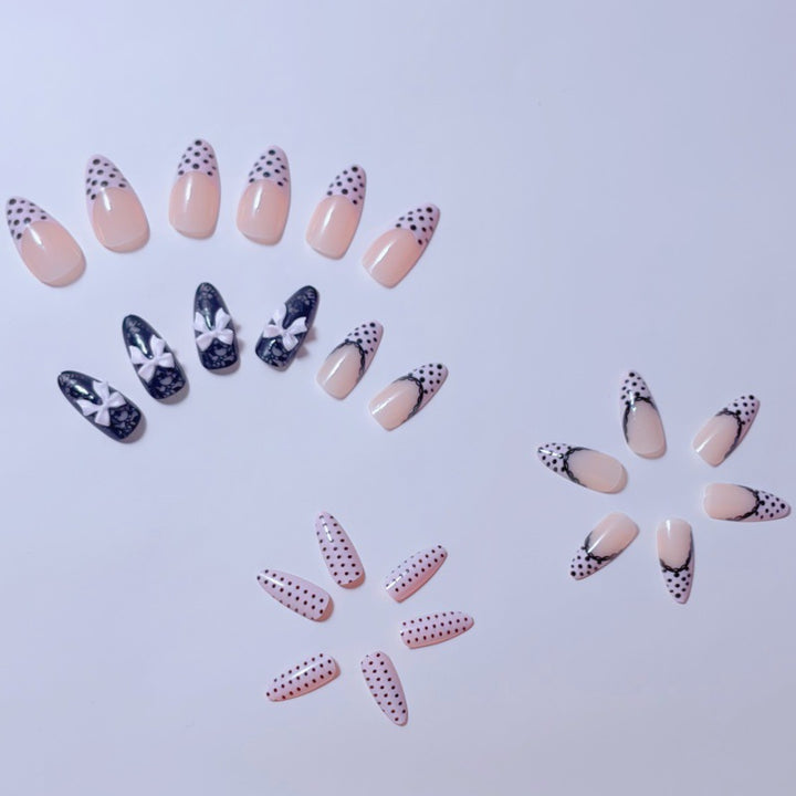 Elegant artificial nails with lace design and bow accents Bowlift
