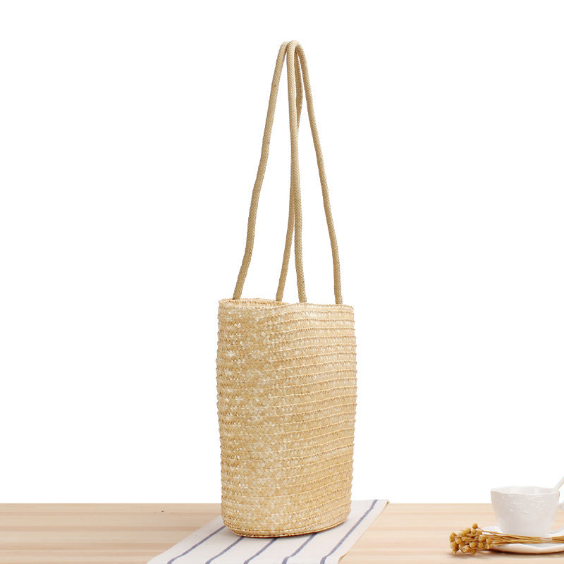 Shoulder bag made of braided natural material with long shoulder straps Bowlift