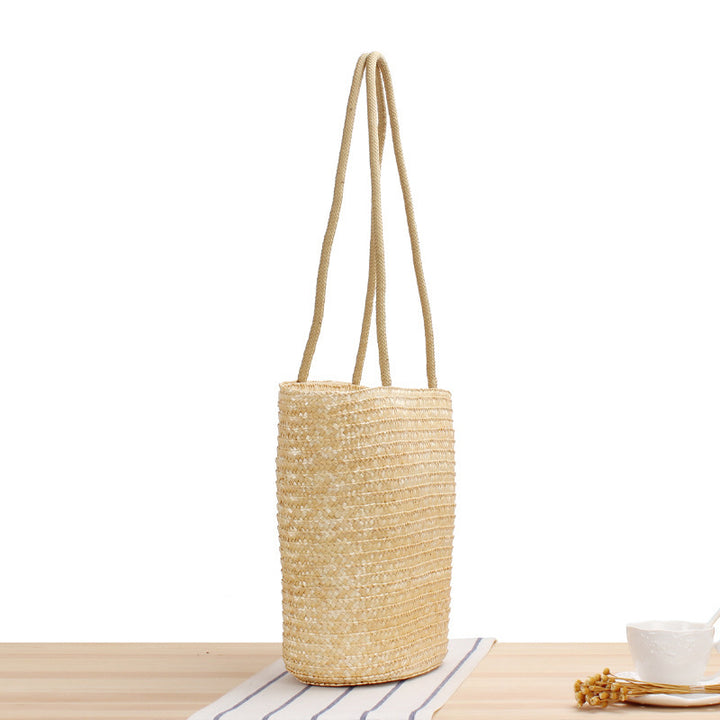 Shoulder bag made of braided natural material with long shoulder straps Bowlift