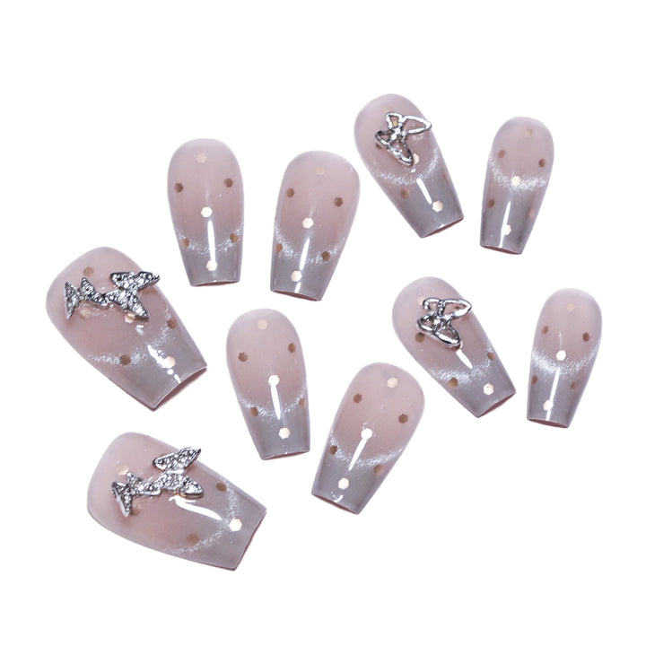 Artificial nail art with glitter details and bow accents Bowlift