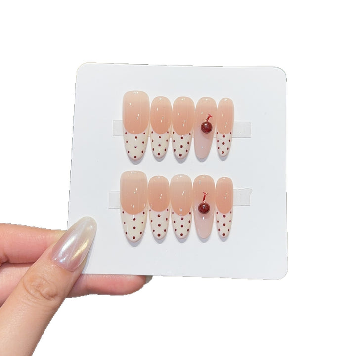 Artificial nails with playful design and cherry accents Bowlift