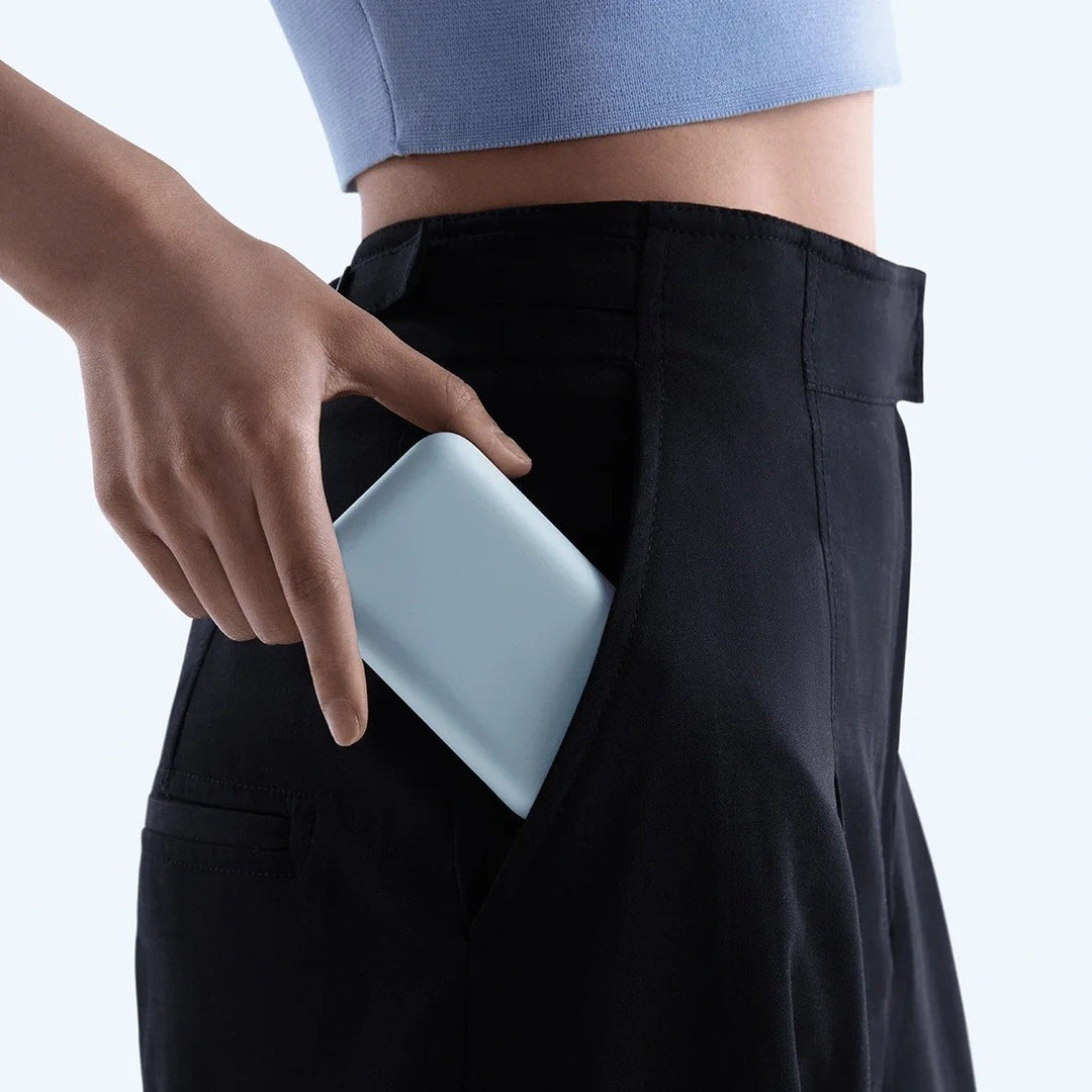 Compact High-capacity portable power bank with integrated USB-C cable and silicone carry loop Bowlift