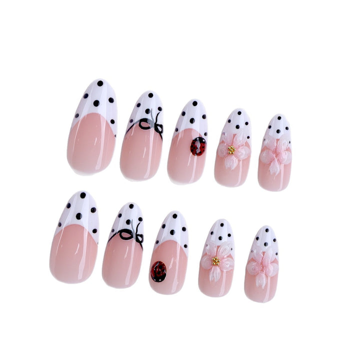 Artificial nail art with floral and playful accents Bowlift