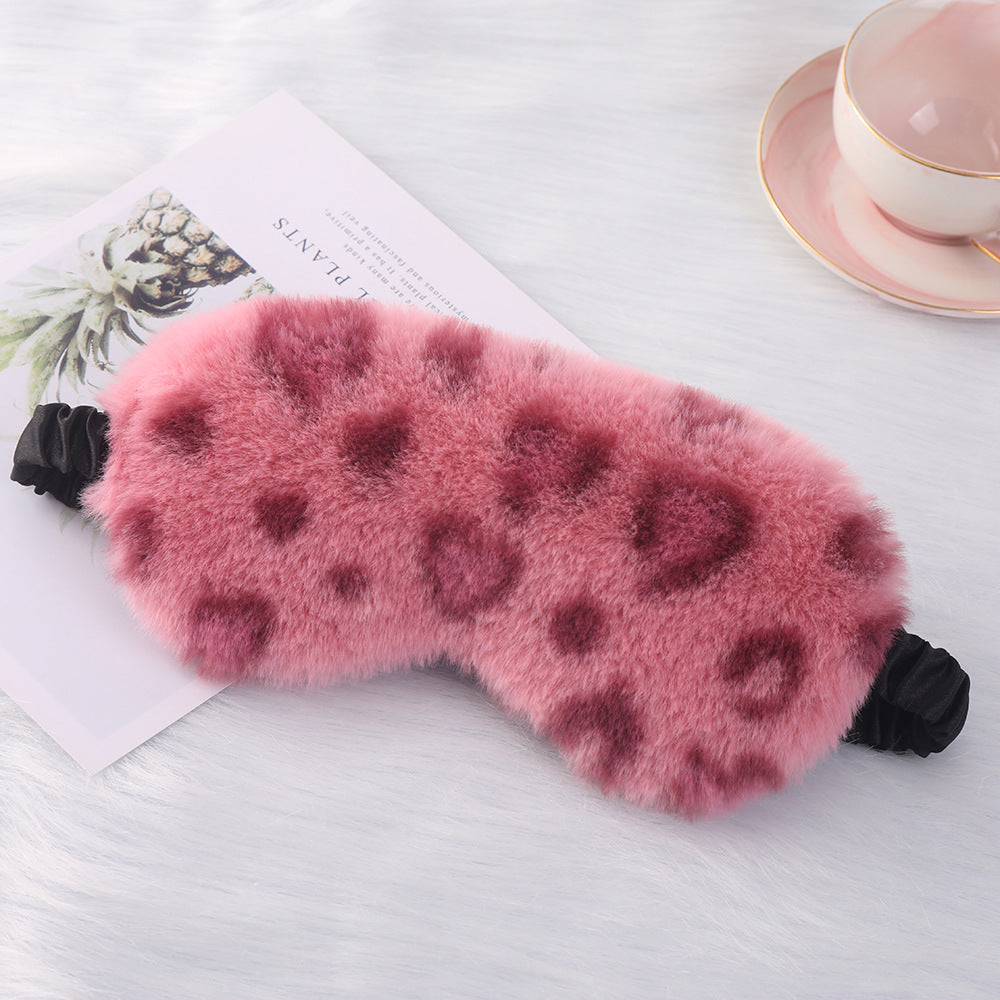 Women's cuddly faux fur sleep mask with heart-embossed surface and gathered comfort band Bowlift