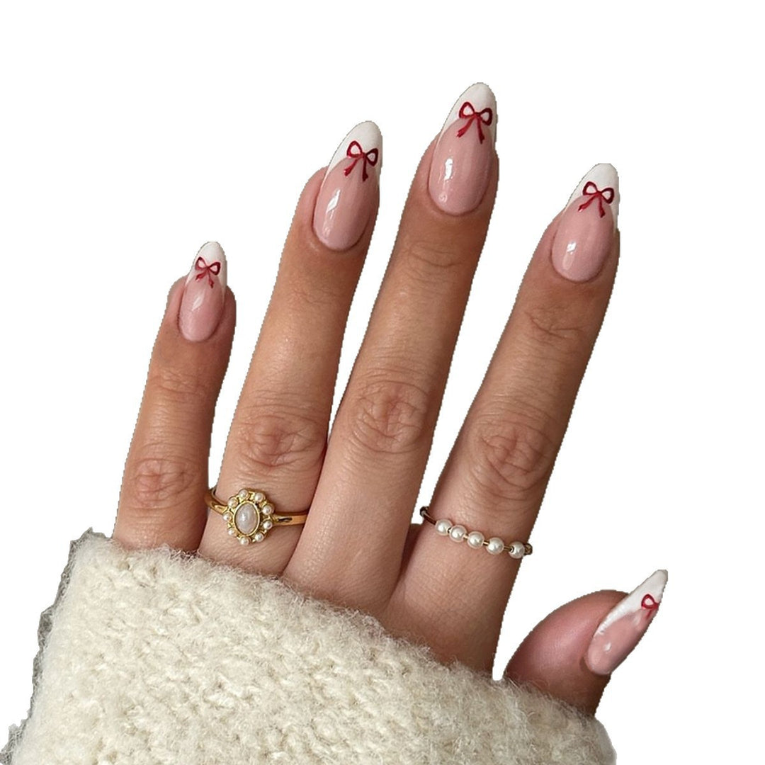 Artificial nail set with playful bow design Bowlift
