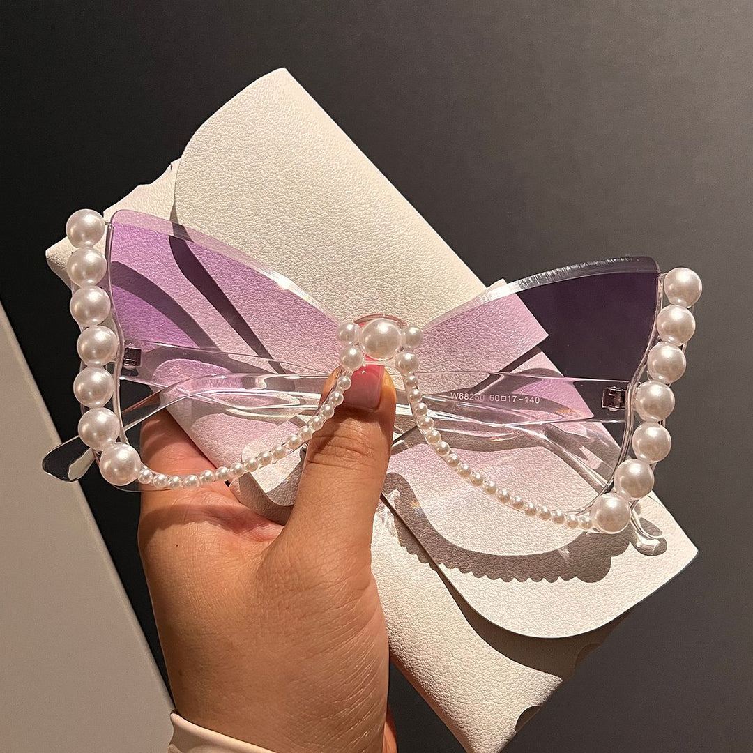 Women striking sunglasses with pearl decoration Bowlift