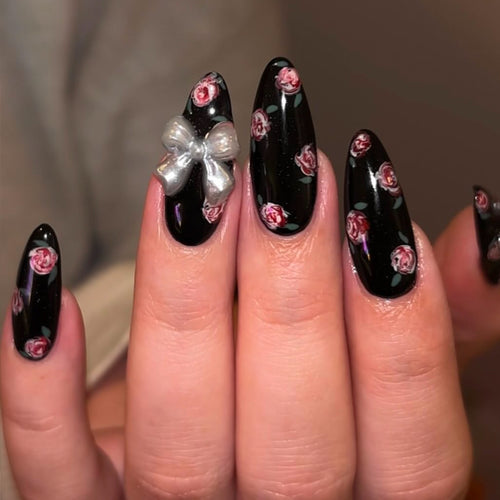 Artificial nails with floral decorations and glamorous bow detail Bowlift