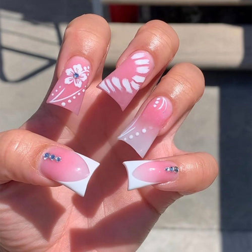 Acrylic nail set with elegant floral designs and glitter accents Bowlift