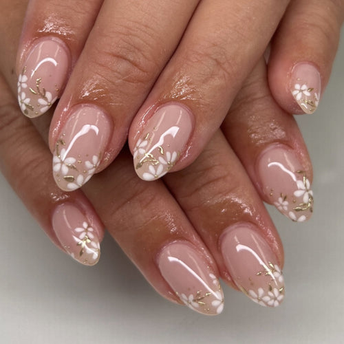 Artful nail art with floral design and glitter accents Bowlift