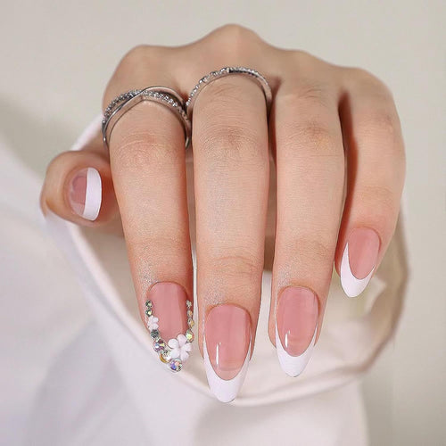 Artificial nails with elegant French tips and rhinestone details Bowlift