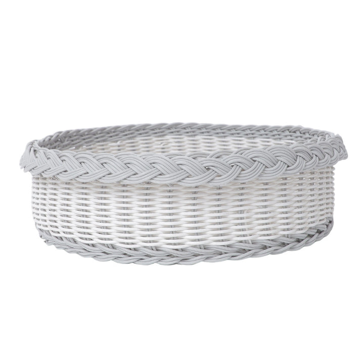 Handwoven storage basket with decorative edge