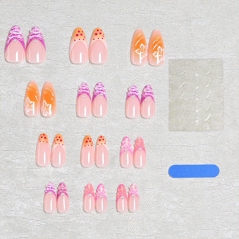 Acrylic nail set with exotic flower patterns and glitter accents Bowlift