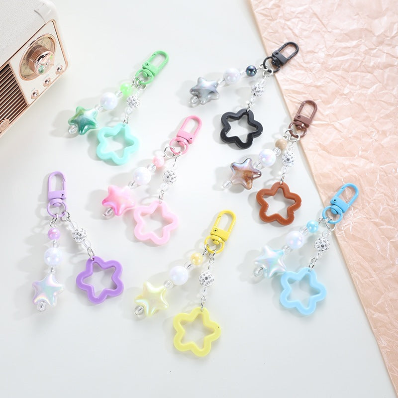 Playful keychain with floral and star motif Bowlift