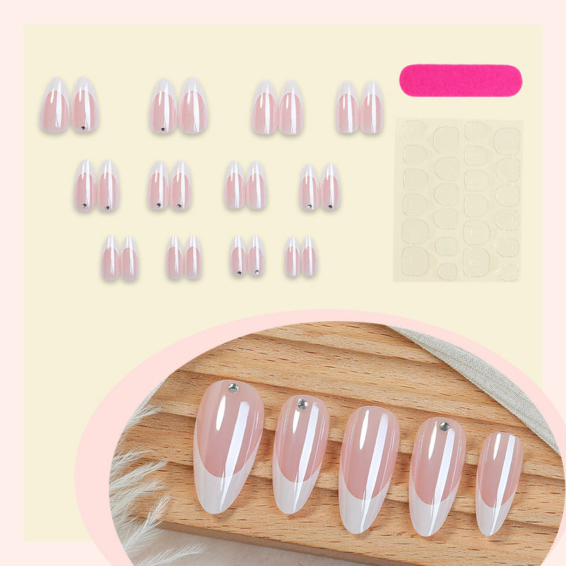 Artificial nail set with elegant French tips and glitter accents Bowlift
