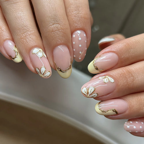 Artful Nail Extensions with Floral Design and Elegant Gold Accents Bowlift