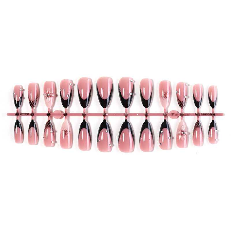 Acrylic nail set with elegant glitter and flower accents Bowlift