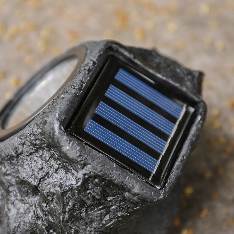 Solar powered faux stone garden spotlight with high efficiency LED array Bowlift