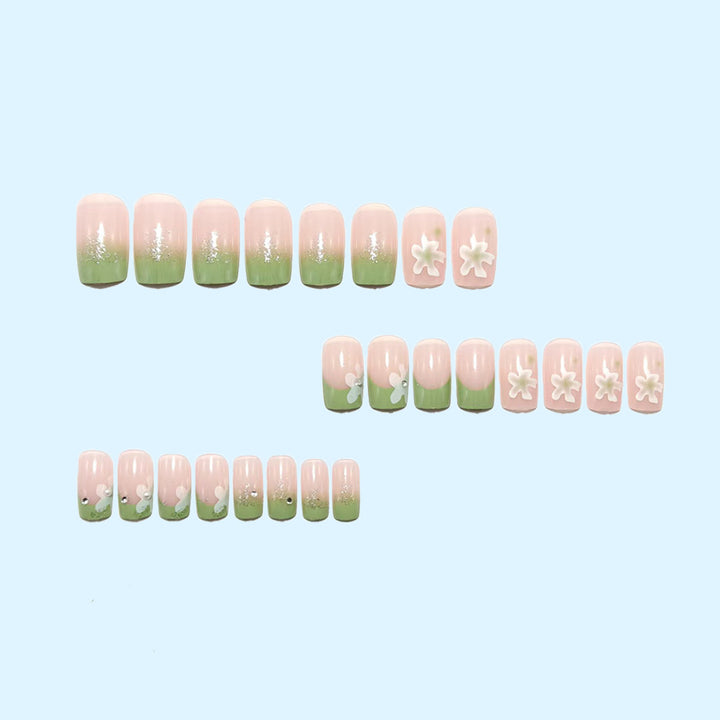 Artificial nails with floral accents and glitter coating Bowlift