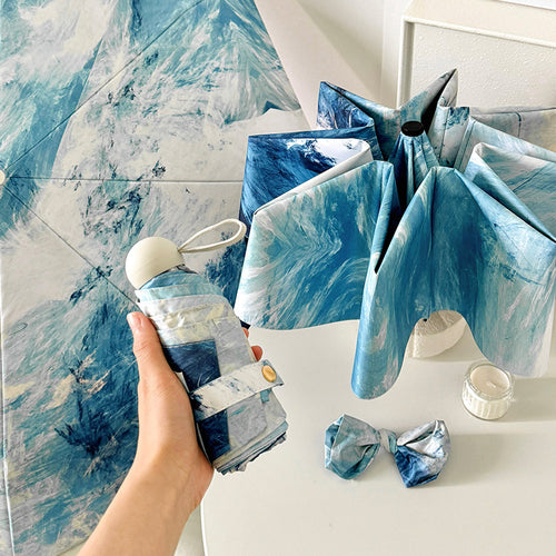 Ladies elegant folding umbrella with unique marble pattern Bowlift