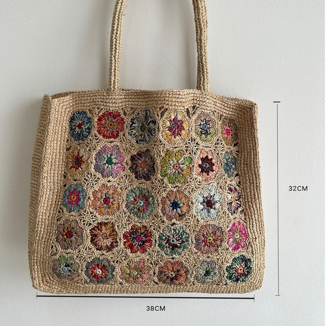 Braided shoulder bag with floral motif Bowlift