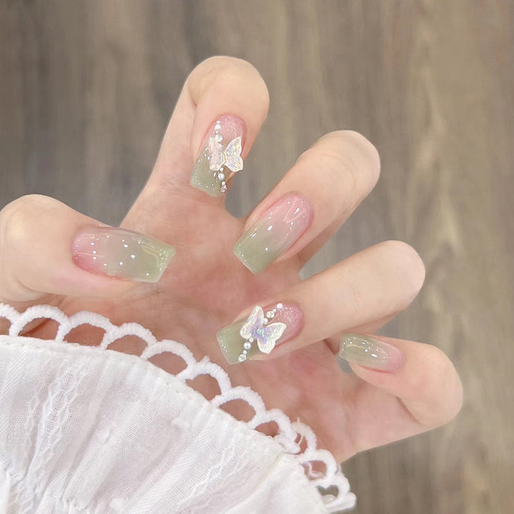 Glamorous artificial nails with delicate flower and glitter effects Bowlift