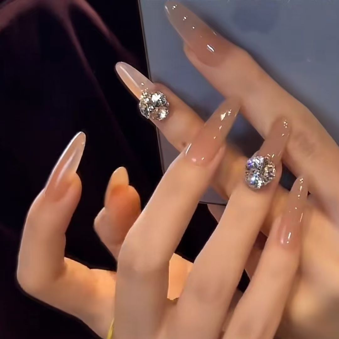 Acrylic nails with glamorous stone accents Bowlift