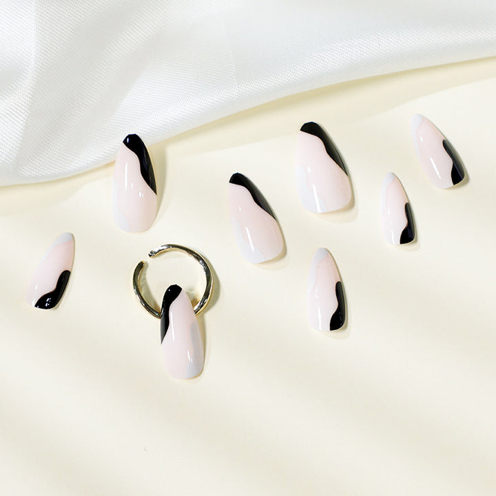 Artful Stiletto Nails with Abstract Color Design Bowlift