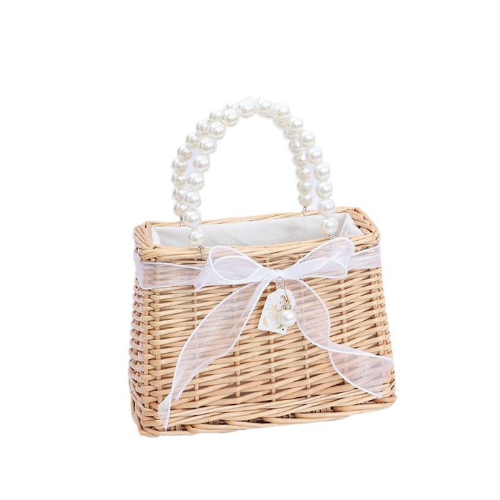 Ladies handbag made of braided material with elegant pearl handles Bowlift