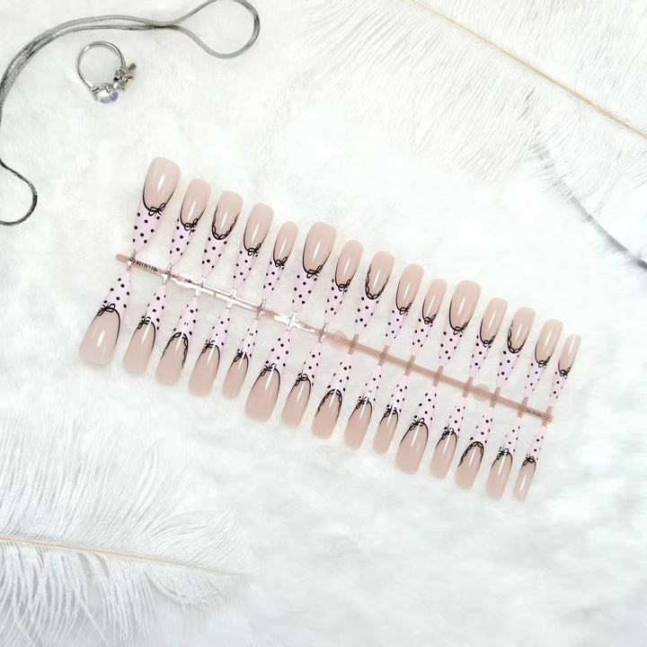 Elegant artificial nails with bow design and dots Bowlift