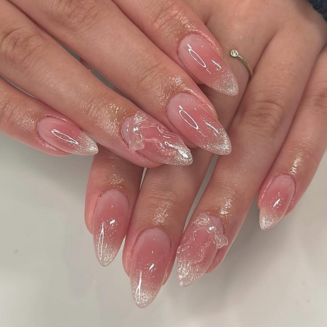 Artistic stiletto nails with elegant French tips and floral design Bowlift