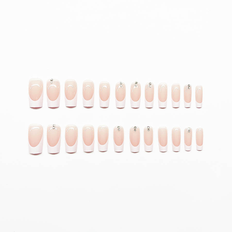 Elegant artificial nail set with high-gloss finish and rhinestone decorations Bowlift