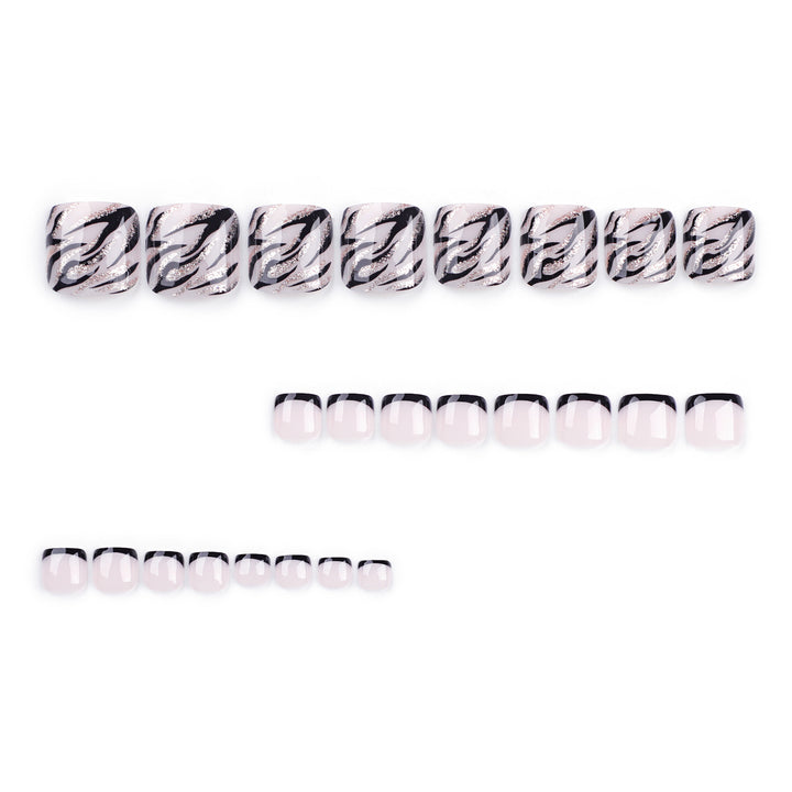 Artificial toenail art in elegant black and white design Bowlift