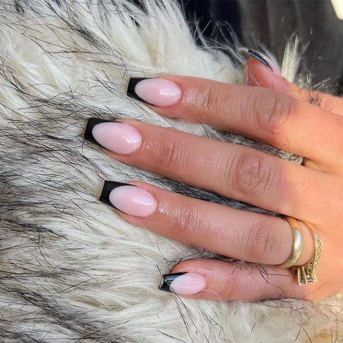 Elegant stiletto nails with contrasting French tip Bowlift
