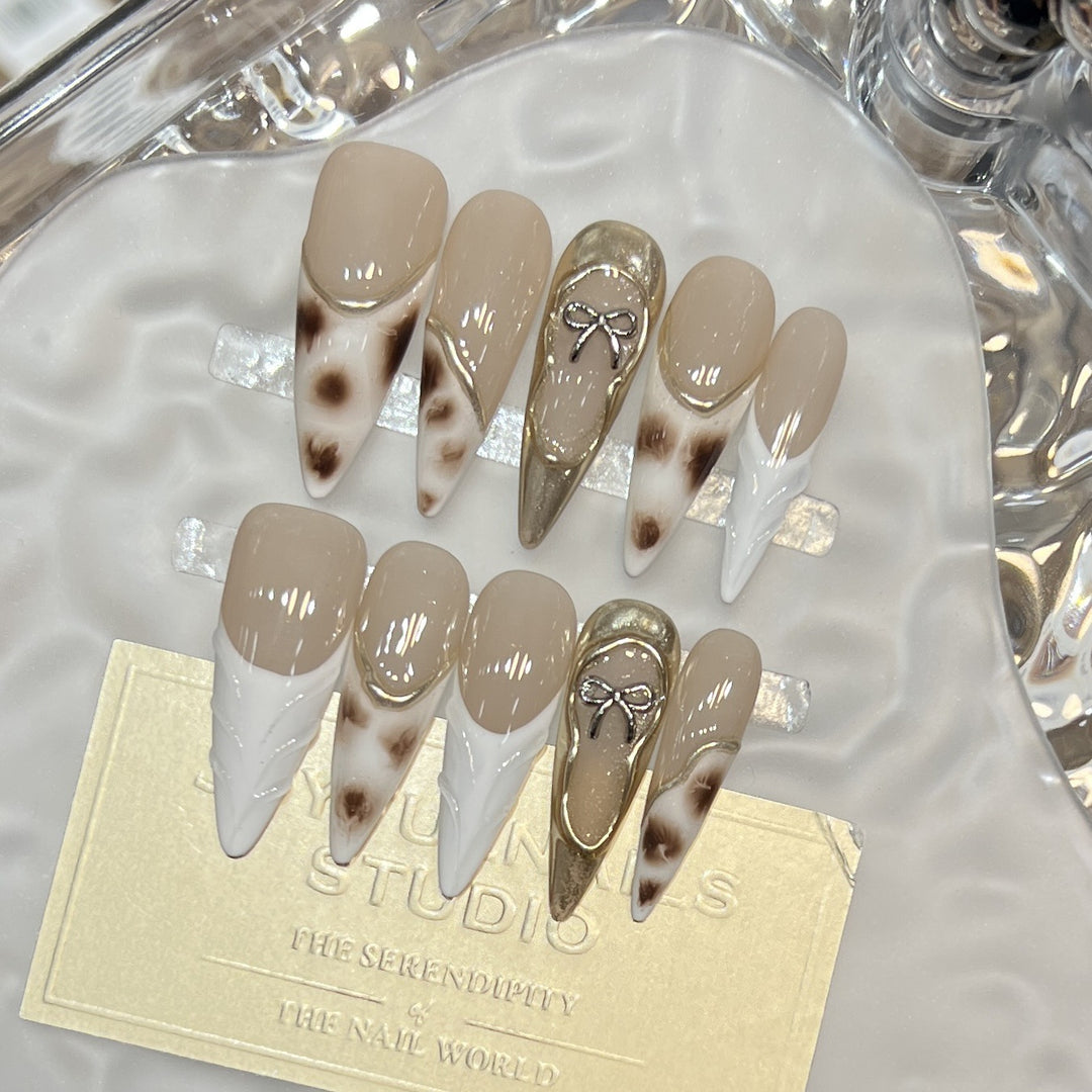 Elegant Stiletto Press-On Nail Set with Decorative Accents Bowlift