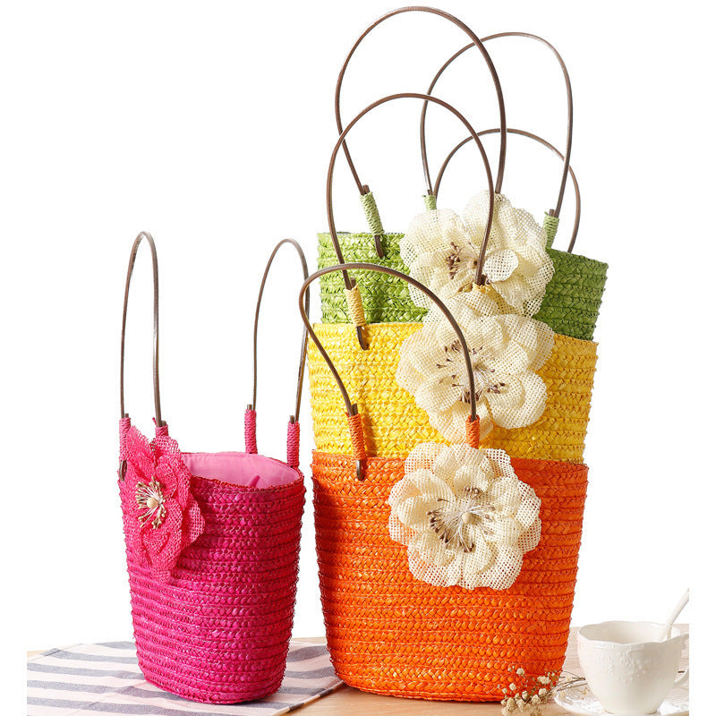 Beach bag with decorative flower detail embellishment Bowlift