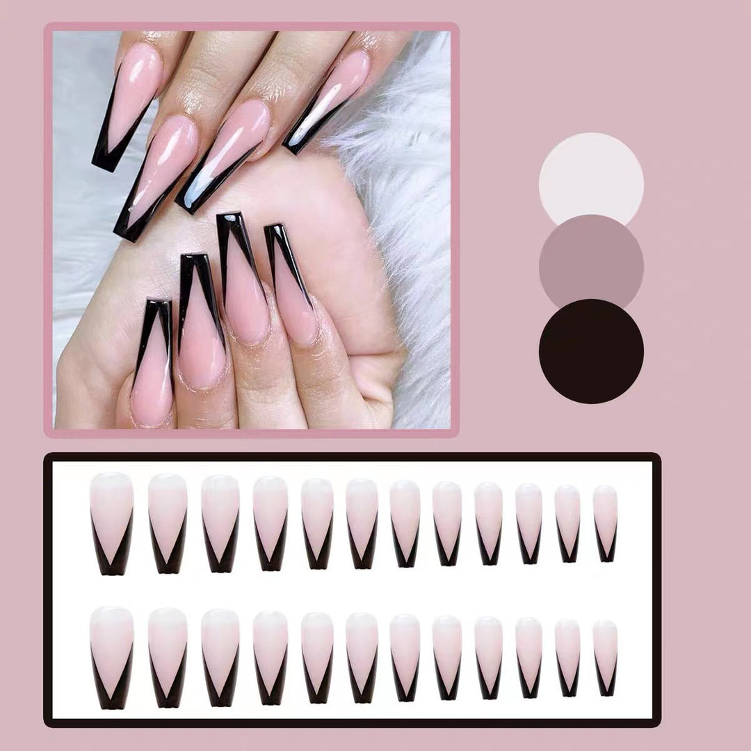 Artificial nail set with elegant stiletto design and glossy accents Bowlift