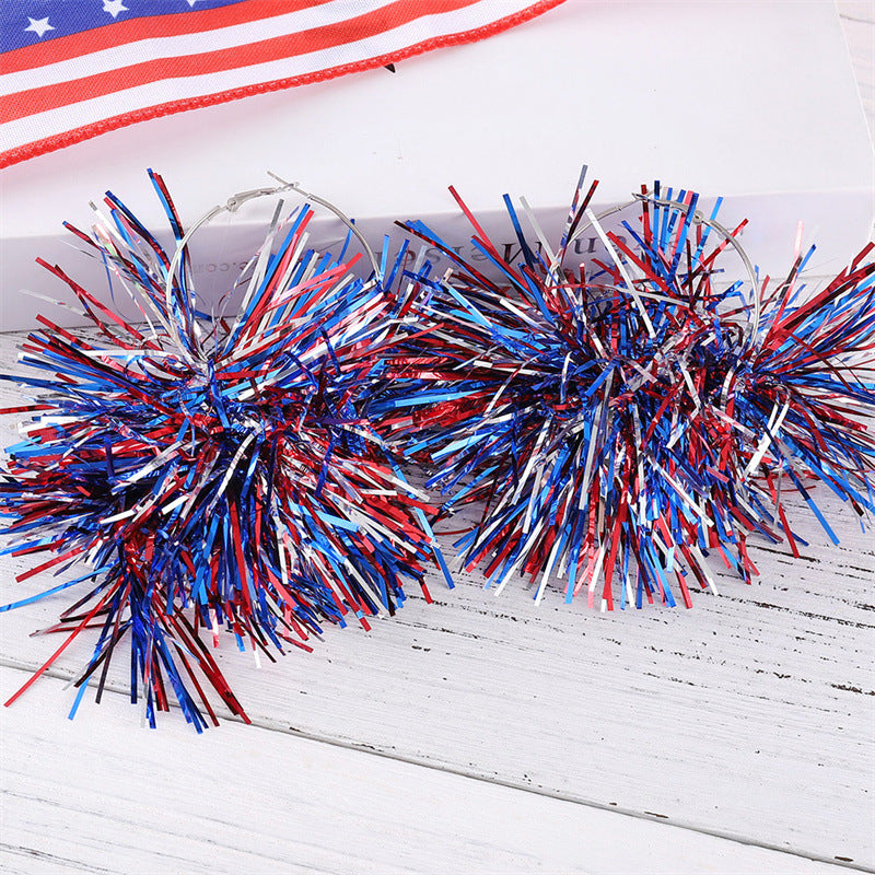 Women with eye-catching pompom hoops with lametta tassels and lightweight wire closure Bowlift