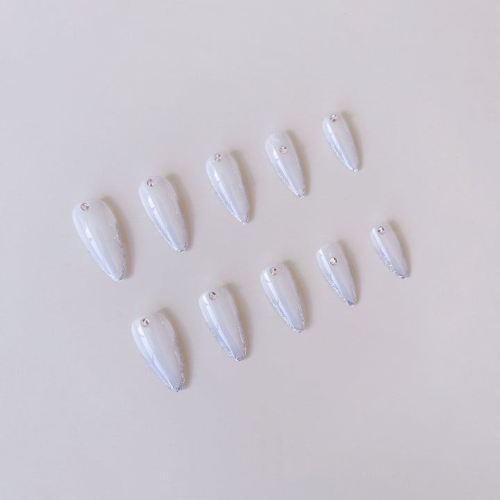Acrylic nail set with elegant tips and sparkling accents Bowlift