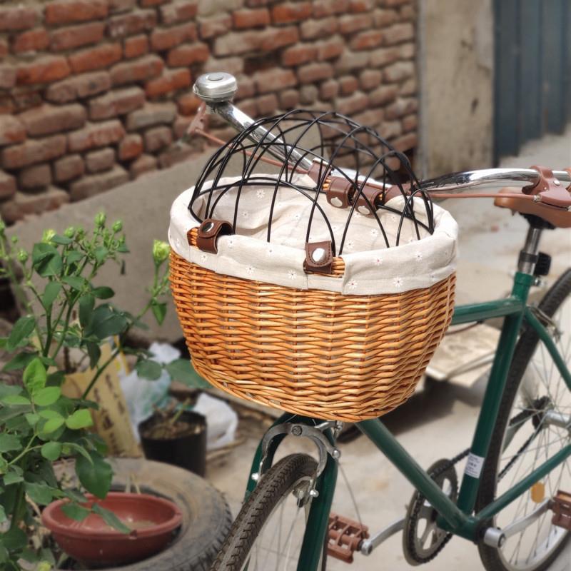 woven rattan pet carrier basket with detachable linen liner and foldable metal safety dome Bowlift