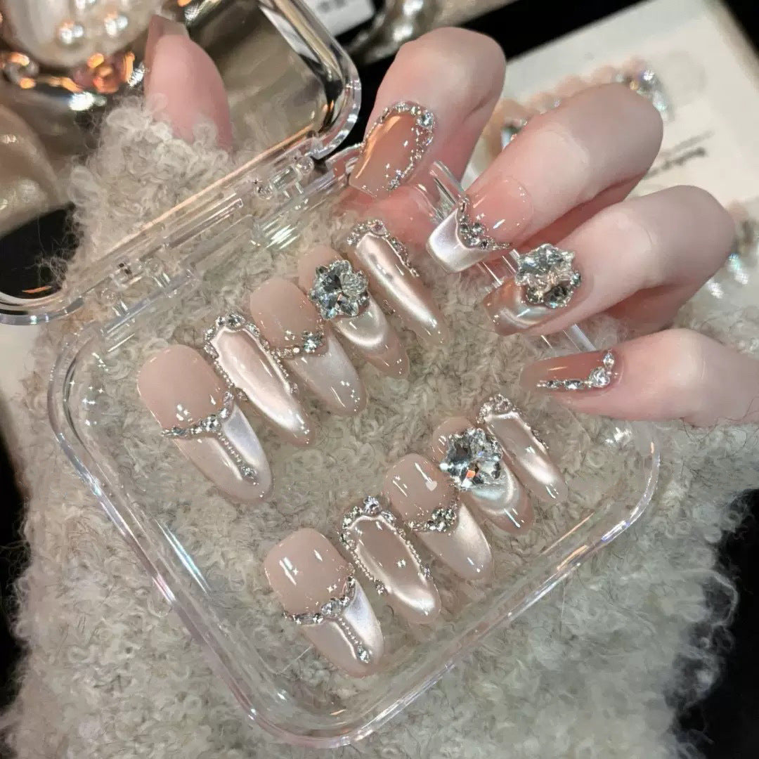 Glamorous nail tips with rhinestone and glitter effects Bowlift