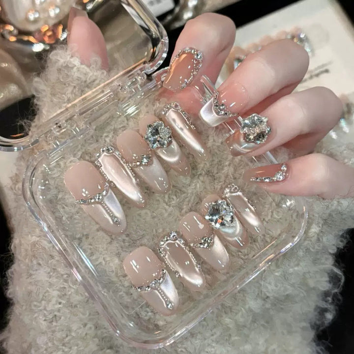 Glamorous nail tips with rhinestone and glitter effects Bowlift