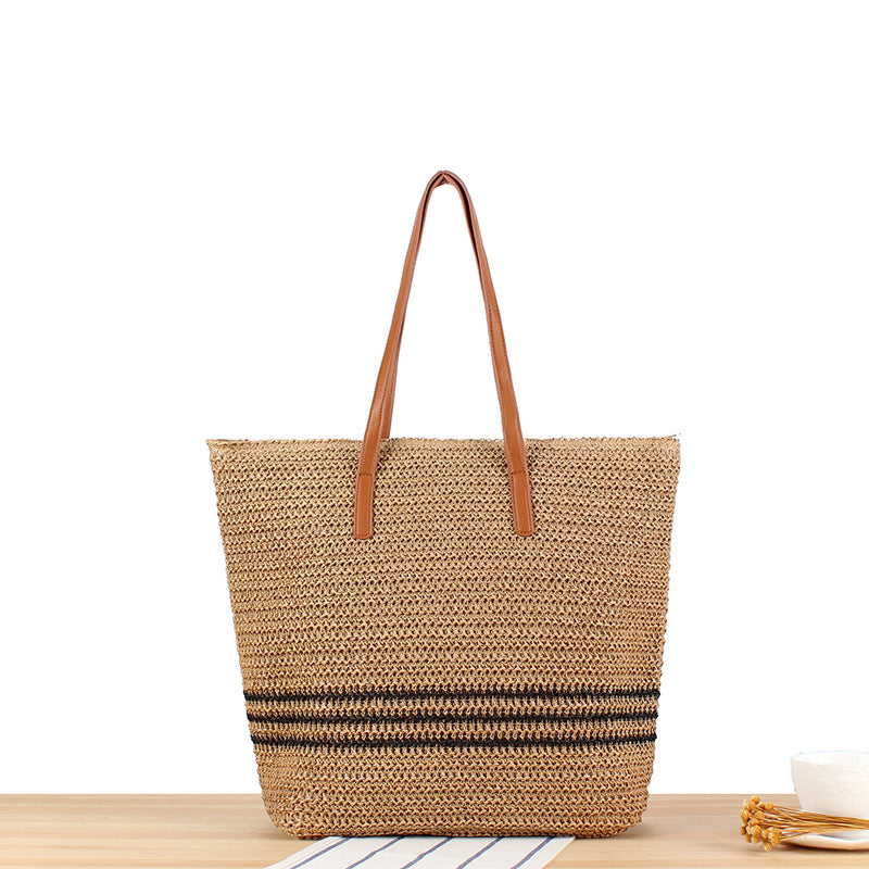 Stylish beach bag made of natural weave with leather handles Bowlift