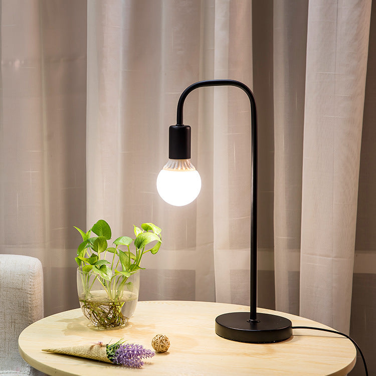 Minimalist Curved-Arm Table Lamp with Round Base and Standard Bulb Socket Bowlift
