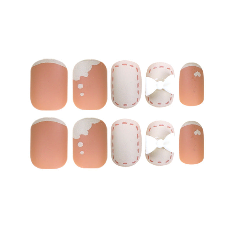 Artistic nail nails with decorative bow designs and French tips Bowlift