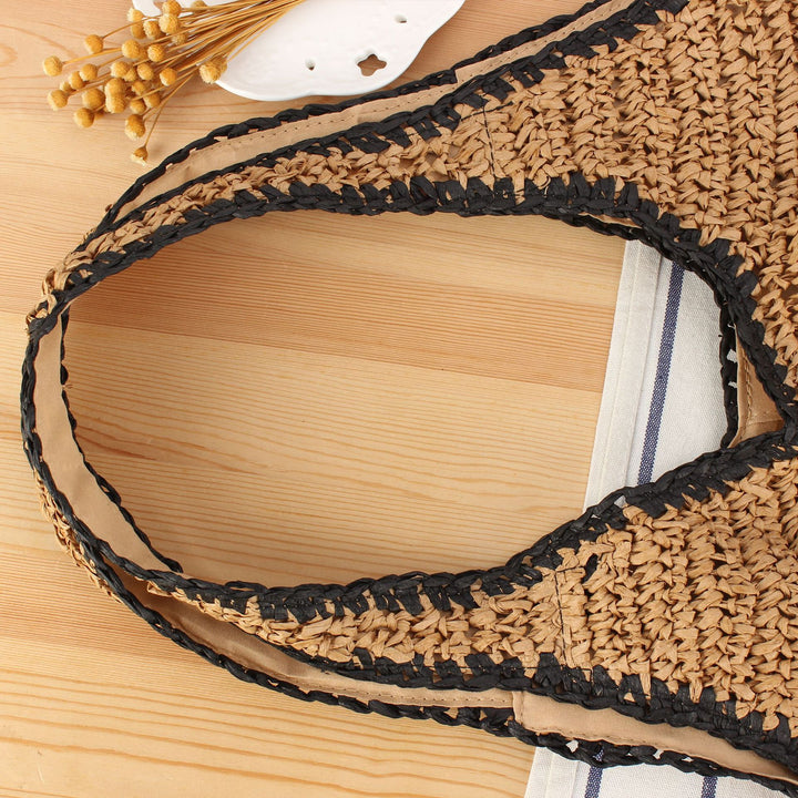 Beach shoulder bag made of handwoven natural material with comfortable carrying handles Bowlift